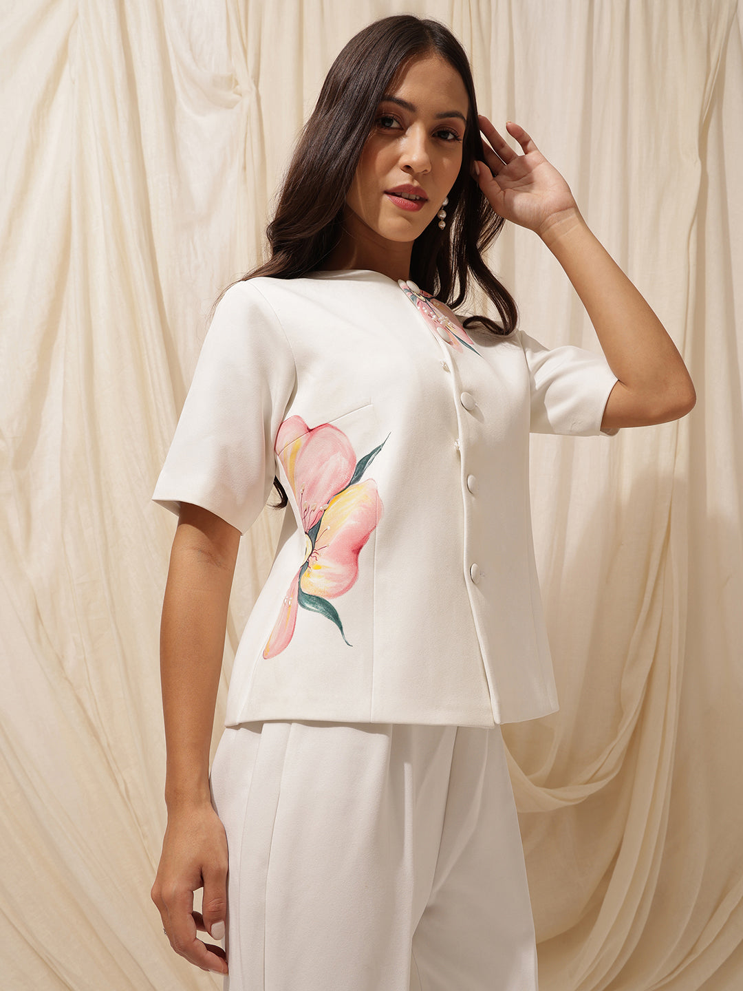Pankhuri Coord-Set- Hand- Painted white floral top/blazer with pearl work along with wide legged pants.